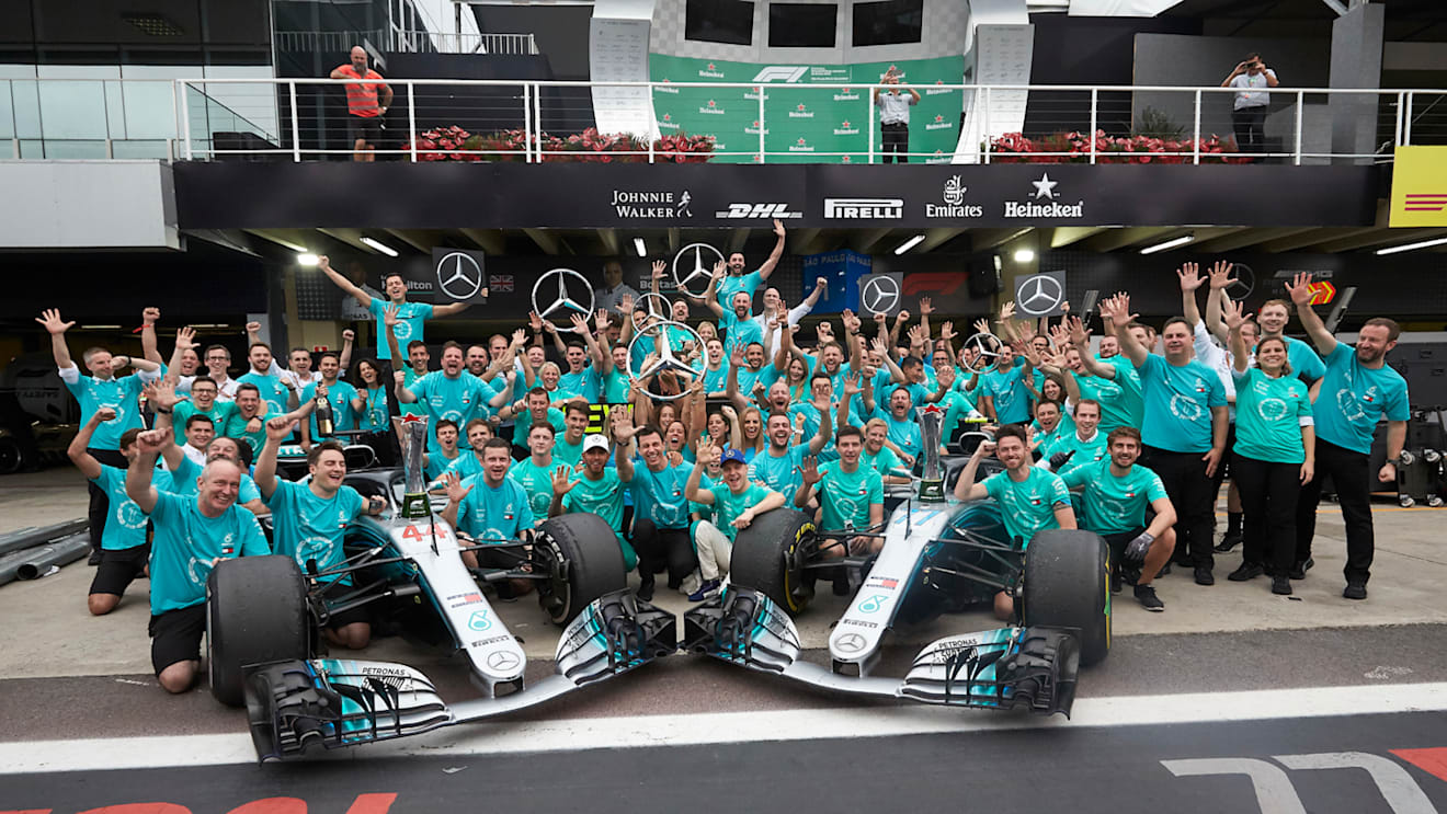 Lewis Hamilton, Mercedes AMG F1, Valtteri Bottas, Mercedes AMG F1, and the Mercedes team celebrate after securing the drivers and constructors titles for 2018 during the Brazilian GP at Autódromo José Carlos Pace on November 11, 2018. (Photo by Steve Etherington / LAT Images)