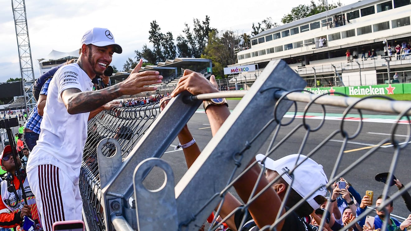 AUTODROMO HERMANOS RODRIGUEZ, MEXICO - OCTOBER 28: Lewis Hamilton, Mercedes AMG F1 celebrates with the fans during the Mexican GP at Autodromo Hermanos Rodriguez on October 28, 2018 in Autodromo Hermanos Rodriguez, Mexico. (Photo by Simon Galloway / Sutton Images)