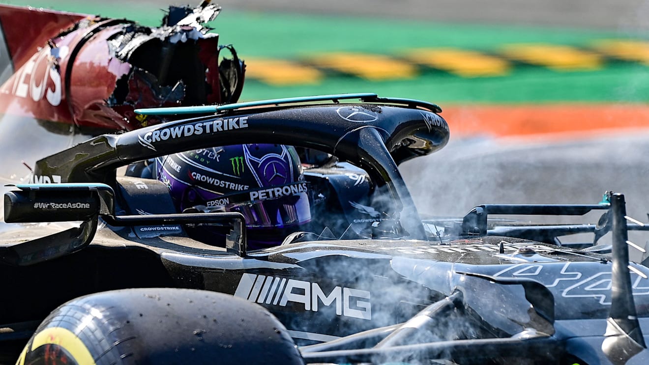 MONZA, ITALY - SEPTEMBER 12: Max Verstappen of the Netherlands driving the (33) Red Bull Racing RB16B Honda and Lewis Hamilton of Great Britain driving the (44) Mercedes AMG Petronas F1 Team Mercedes W12 crash during the F1 Grand Prix of Italy at Autodromo di Monza on September 12, 2021 in Monza, Italy. 