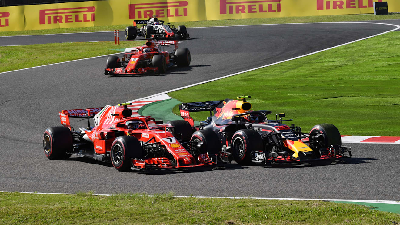 SUZUKA, JAPAN - OCTOBER 07: Kimi Raikkonen, Ferrari SF71H and Max Verstappen, Red Bull Racing RB14 battle during the Japanese GP at Suzuka on October 07, 2018 in Suzuka, Japan. (Photo by Mark Sutton / Sutton Images)