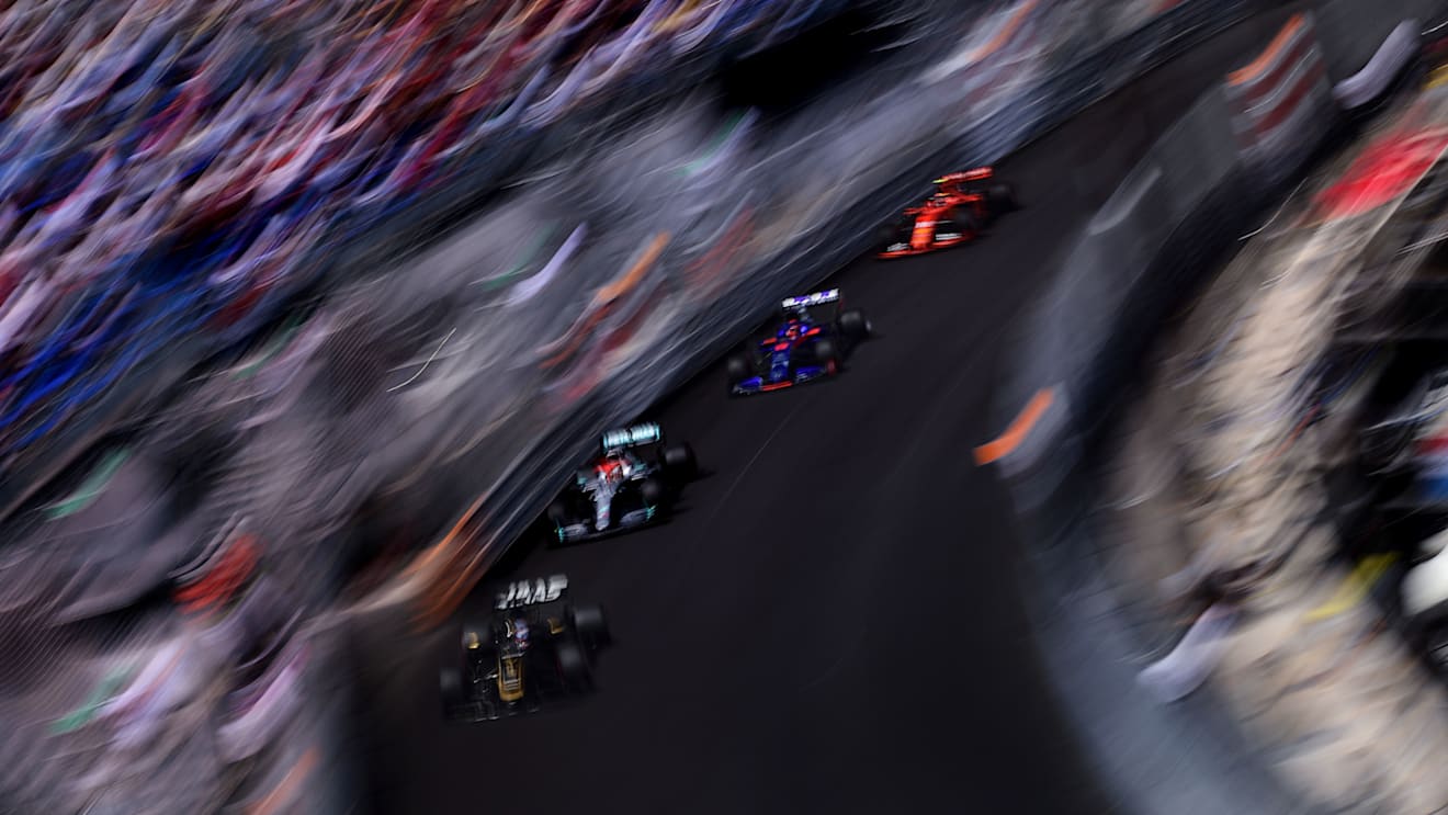 A pack of cars approach the Swimming Pool at speed. (Photo by Mario Renzi)