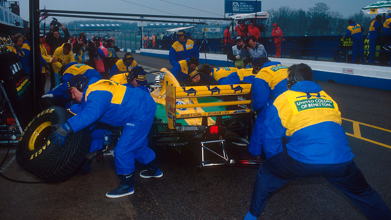 Benetton's crew, seen here changing the tyres on Riccardo Patrese's car at the 1993 European Grand Prix, were standard setters for pit stops pre-1994. © LAT Photographic