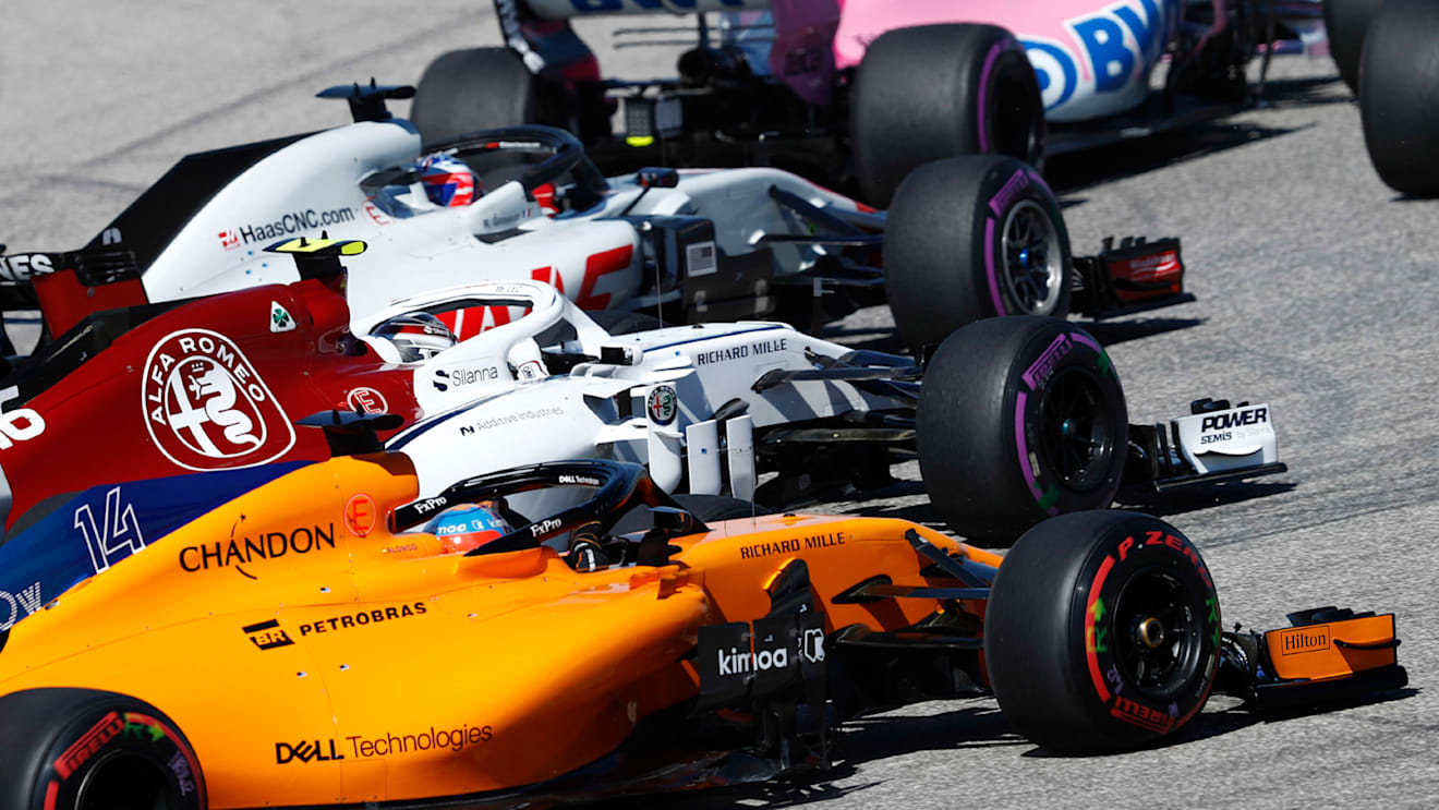 CIRCUIT OF THE AMERICAS, UNITED STATES OF AMERICA - OCTOBER 21: Romain Grosjean, Haas F1 Team VF-18, leads Charles Leclerc, Sauber C37 Ferrari, and Fernando Alonso, McLaren MCL33, at the start during the United States GP at Circuit of the Americas on October 21, 2018 in Circuit of the Americas, United States of America. (Photo by Glenn Dunbar / LAT Images)