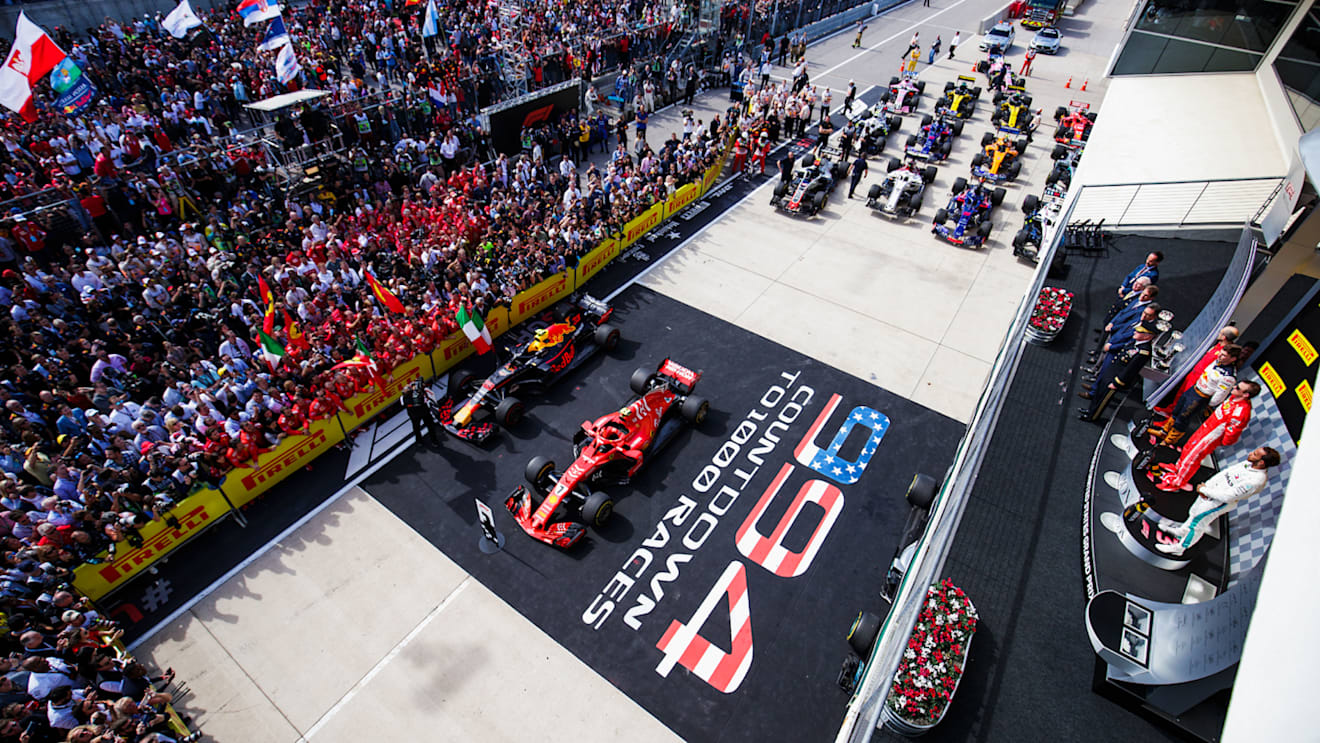 CIRCUIT OF THE AMERICAS, UNITED STATES OF AMERICA - OCTOBER 21: Max Verstappen, Red Bull Racing, 2nd position, Kimi Raikkonen, Ferrari, 1st position, and Lewis Hamilton, Mercedes AMG F1, 3rd position, on the podium during the United States GP at Circuit of the Americas on October 21, 2018 in Circuit of the Americas, United States of America. (Photo by Zak Mauger / LAT Images)
