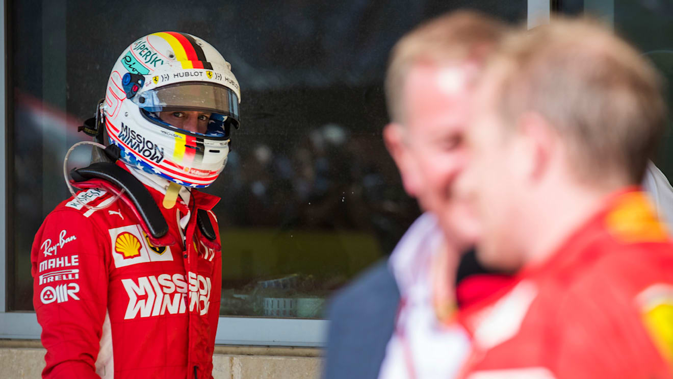 CIRCUIT OF THE AMERICAS, UNITED STATES OF AMERICA - OCTOBER 21: Sebastian Vettel, Ferrari, looks over as Kimi Raikkonen, Ferrari, 1st position, is interviewed by Martin Brundle, Sky Sports F1 during the United States GP at Circuit of the Americas on October 21, 2018 in Circuit of the Americas, United States of America. (Photo by Sam Bloxham / LAT Images)