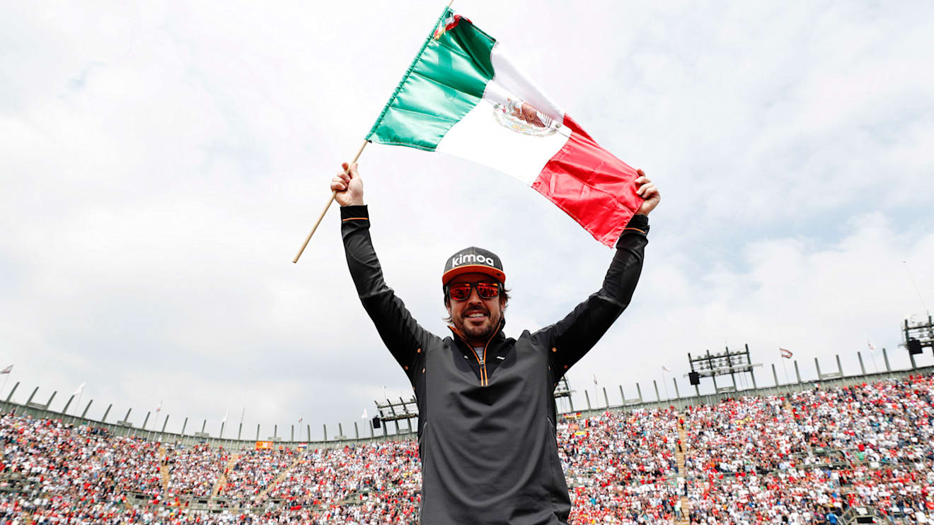 AUTODROMO HERMANOS RODRIGUEZ, MEXICO - OCTOBER 28: Fernando Alonso, McLaren, celebrates with a Mexican flag ahead of the race during the Mexican GP at Autodromo Hermanos Rodriguez on October 28, 2018 in Autodromo Hermanos Rodriguez, Mexico. (Photo by Steven Tee / LAT Images)