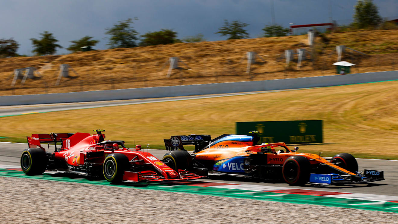 Lando Norris, McLaren MCL35, battles with Charles Leclerc, Ferrari SF1000