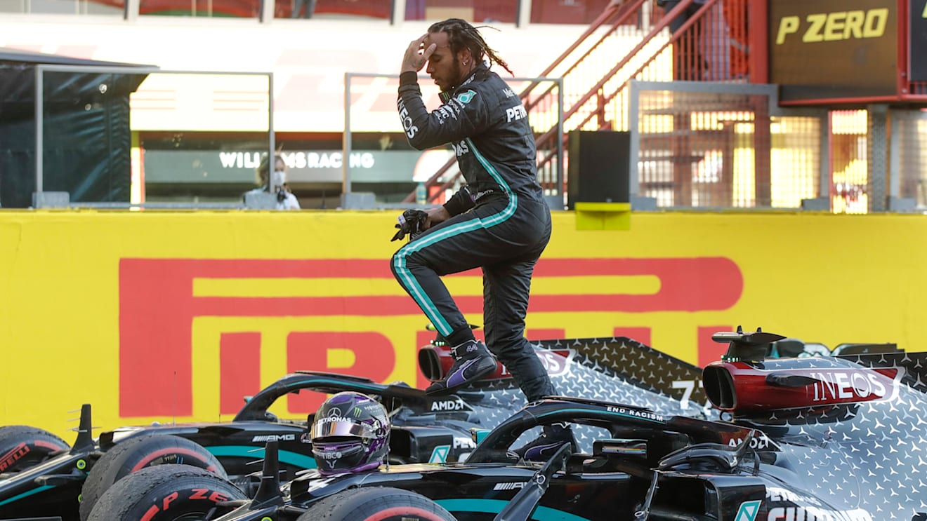 Mercedes driver Lewis Hamilton of Britain jumps out of his car after winning the Formula One Grand Prix of Tuscany, at the Mugello circuit in Scarperia, Italy, Sunday, Sept. 13, 2020. (AP Photo/Luca Bruno, Pool)