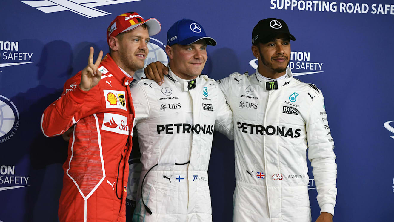 (L to R): Sebastian Vettel (GER) Ferrari, pole sitter Valtteri Bottas (FIN) Mercedes AMG F1 and Lewis Hamilton (GBR) Mercedes AMG F1 celebrate in parc ferme at Formula One World Championship, Rd20, Abu Dhabi Grand Prix, Qualifying, Yas Marina Circuit, Abu Dhabi, UAE, Saturday 25 November 2017. © Mark Sutton/Sutton Images