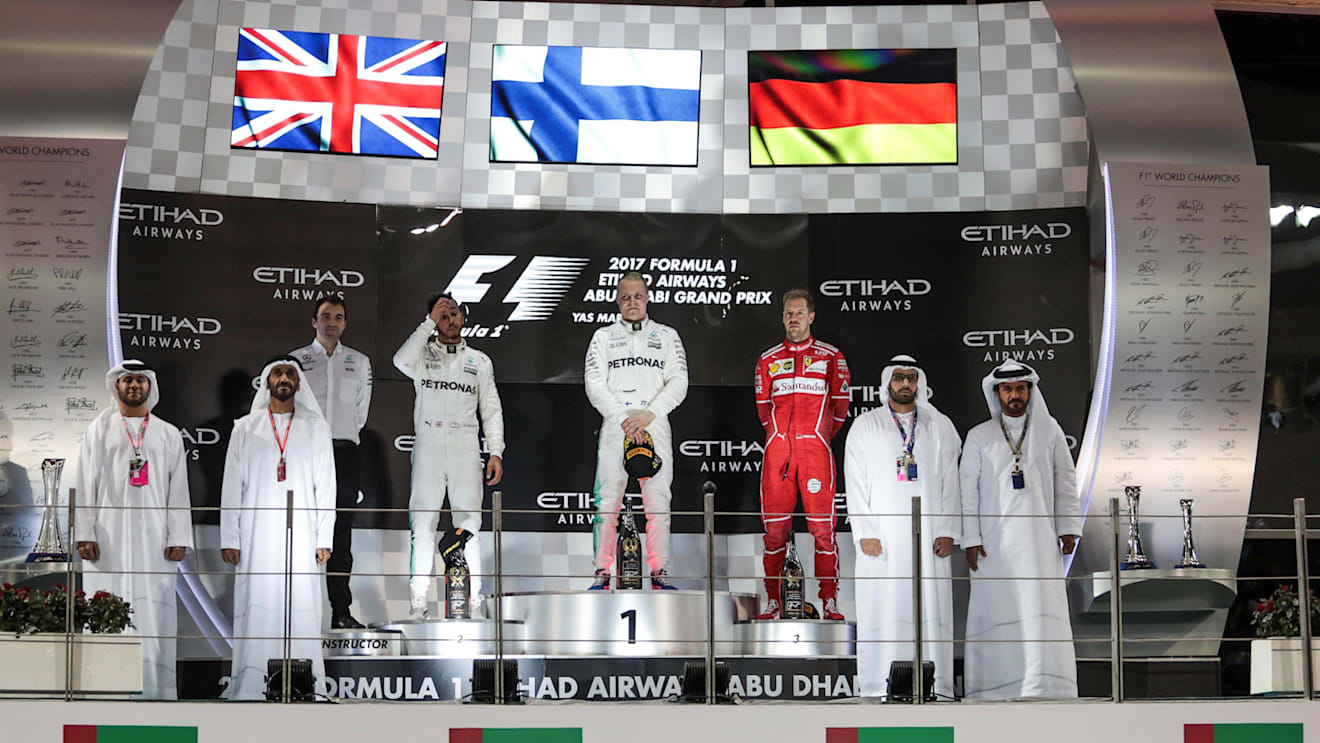 Lewis Hamilton (GBR) Mercedes AMG F1, Valtteri Bottas (FIN) Mercedes AMG F1 and Sebastian Vettel (GER) Ferrari on the podium at Formula One World Championship, Rd20, Abu Dhabi Grand Prix, Race, Yas Marina Circuit, Abu Dhabi, UAE, Sunday 26 November 2017. © Manuel Goria/Sutton Images