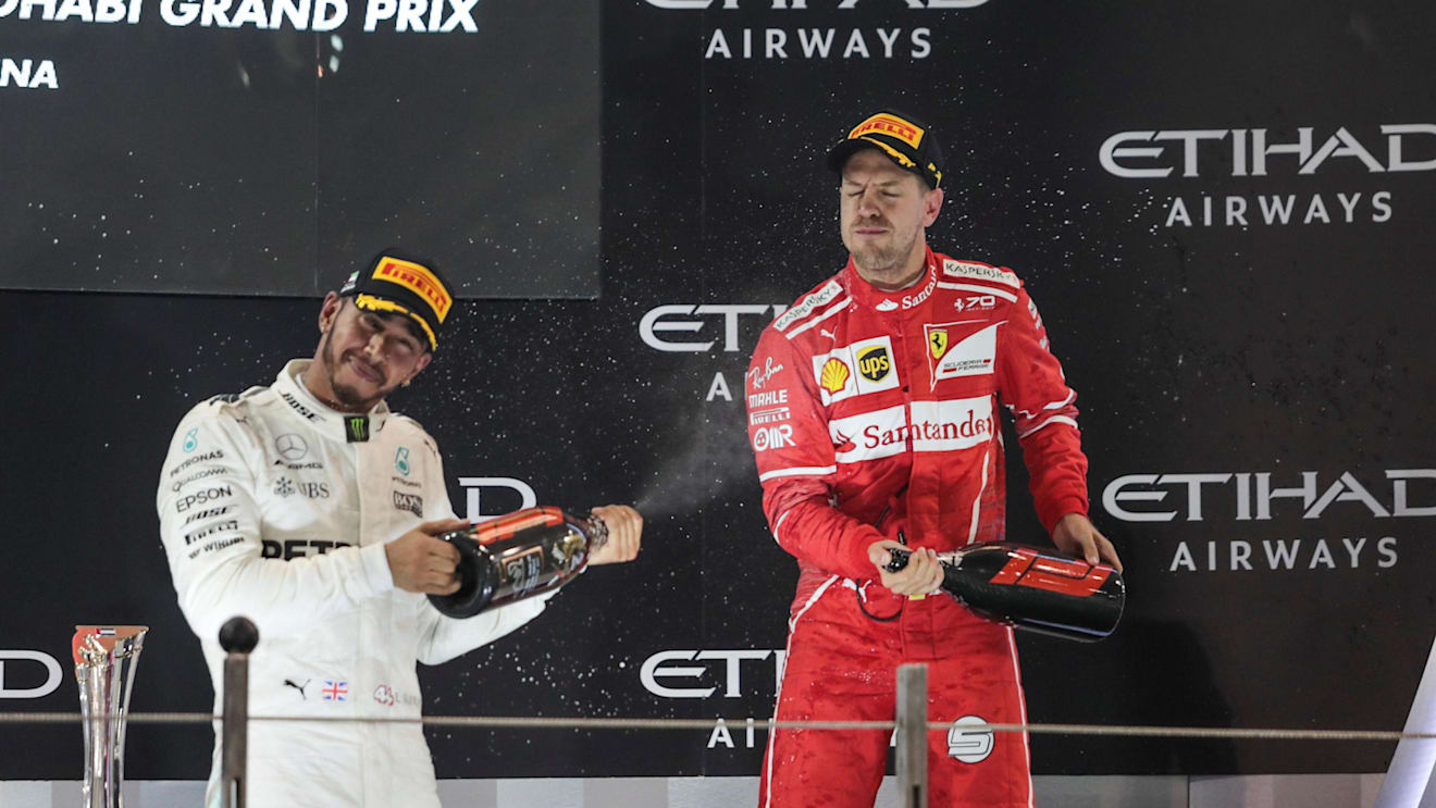 Lewis Hamilton (GBR) Mercedes AMG F1 and Sebastian Vettel (GER) Ferrari celebrate on the podium at Formula One World Championship, Rd20, Abu Dhabi Grand Prix, Race, Yas Marina Circuit, Abu Dhabi, UAE, Sunday 26 November 2017. © Manuel Goria/Sutton Images