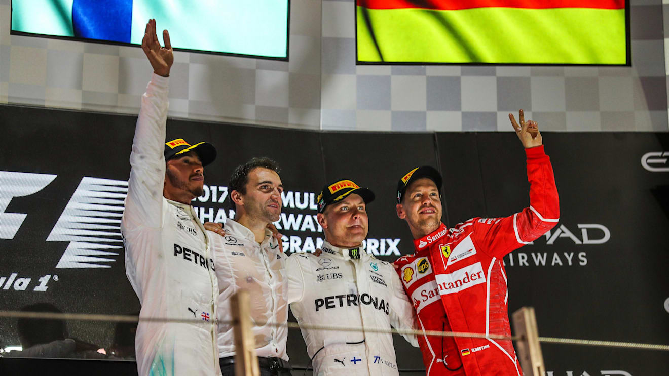 Lewis Hamilton (GBR) Mercedes AMG F1, Valtteri Bottas (FIN) Mercedes AMG F1 and Sebastian Vettel (GER) Ferrari celebrate on the podium at Formula One World Championship, Rd20, Abu Dhabi Grand Prix, Race, Yas Marina Circuit, Abu Dhabi, UAE, Sunday 26 November 2017. © Kym Illman/Sutton Images