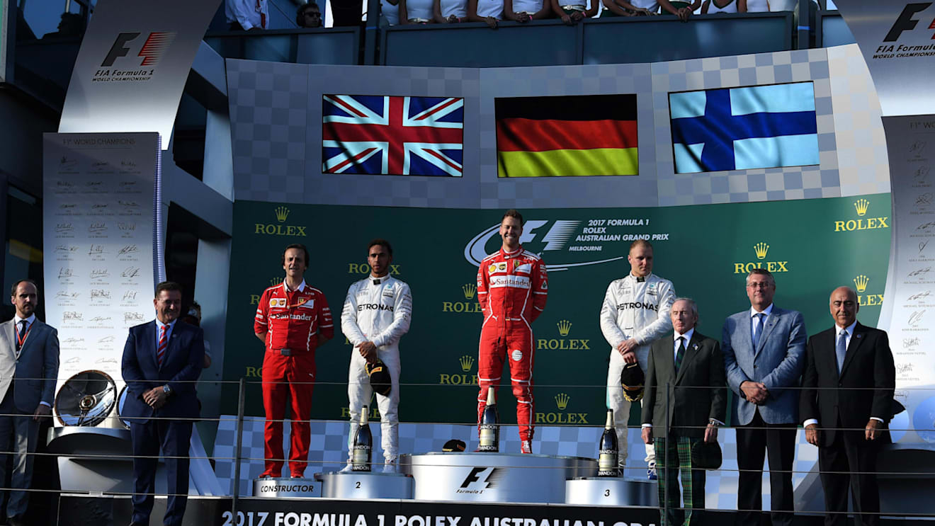 Luigi Fraboni (ITA), Lewis Hamilton (GBR), race winner Sebastian Vettel (GER) and Valtteri Bottas (FIN) celebrate on the podium at F1 World Championship, Australian Grand Prix, Albert Park, Melbourne, Australia, 26 March 2017. © Sutton Motorsport Images
