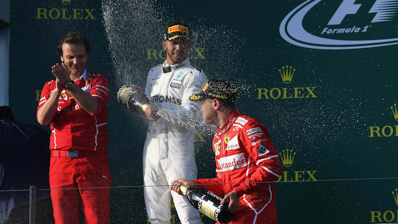 Sebastian Vettel (GER) Ferrari and Lewis Hamilton (GBR) Mercedes AMG F1 celebrate on the podium with the champagne at Formula One World Championship, Australian Grand Prix, Race, Melbourne, Australia, Sunday 26 March 2017. © Sutton Motorsport Images