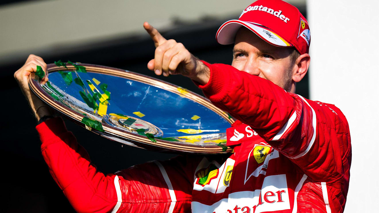 Race winner Sebastian Vettel (GER) Ferrari celebrates on the podium with the trophy at Formula One World Championship, Rd1, Australian Grand Prix, Race, Albert Park, Melbourne, Australia, Sunday 26 March 2017. © Sutton Motorsport Images