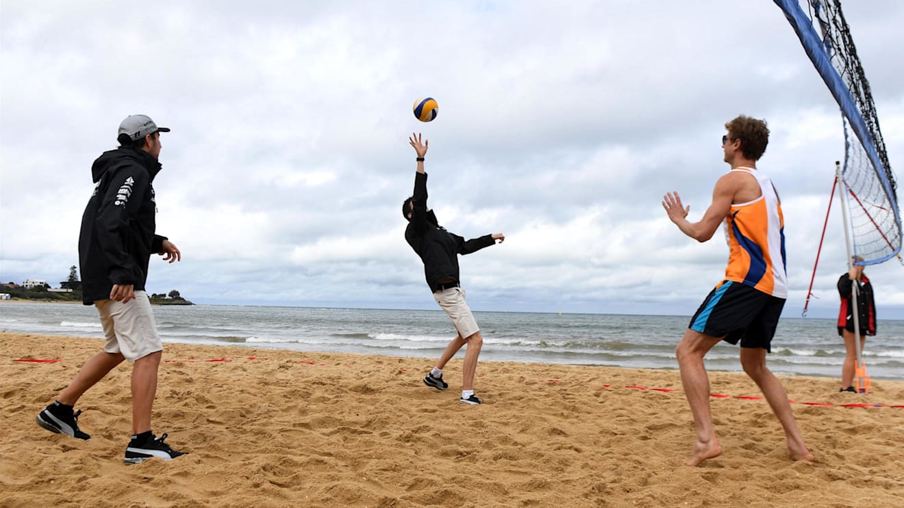 Sergio Perez (MEX) and Esteban Ocon (FRA) of Force India play Beach Volleyball with Tamsin Hinchley (AUS) Olympic Volleyball player. F1 World Championship, Australian Grand Prix, Preparations, Melbourne, Australia, 22 March 2017. ©Sutton Motorsport Images