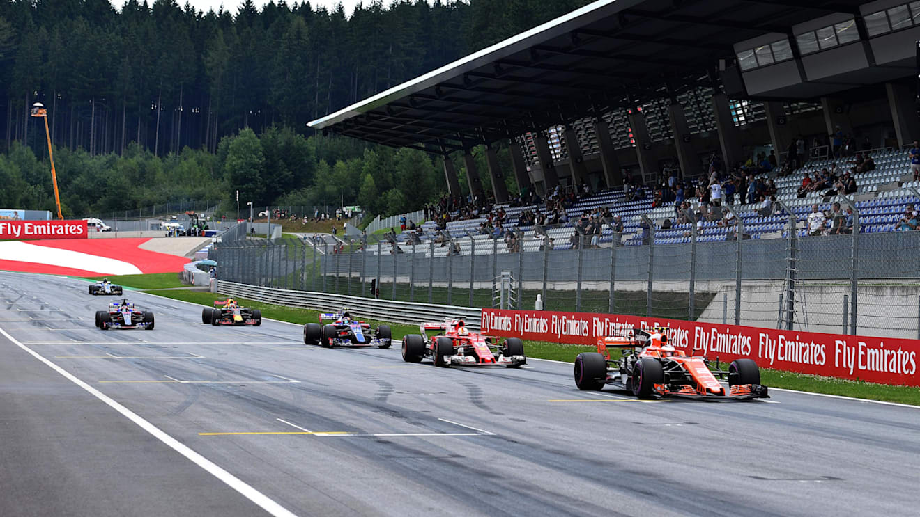Stoffel Vandoorne (BEL) McLaren MCL32 dn Sebastian Vettel (GER) Ferrari SF70-H practice starts at Formula One World Championship, Rd9, Austrian Grand Prix, Practice, Spielberg, Austria, Friday 7 July 2017. © Sutton Images