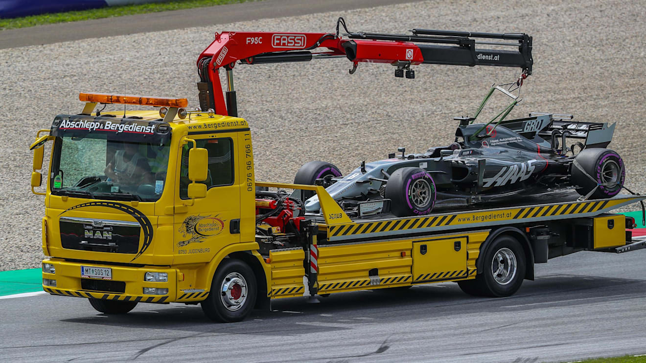 The car of Romain Grosjean (FRA) Haas VF-17 is recovered after suffering a broken rear suspension at Formula One World Championship, Rd9, Austrian Grand Prix, Qualifying, Spielberg, Austria, Saturday 8 July 2017. © Sutton Images