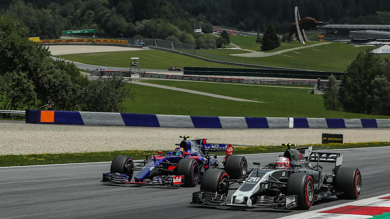 Kevin Magnussen (DEN) Haas VF-17 and Carlos Sainz (ESP) Scuderia Toro Rosso STR12 battle for position at Formula One World Championship, Rd9, Austrian Grand Prix, Race, Spielberg, Austria, Sunday 9 July 2017. © Sutton Images