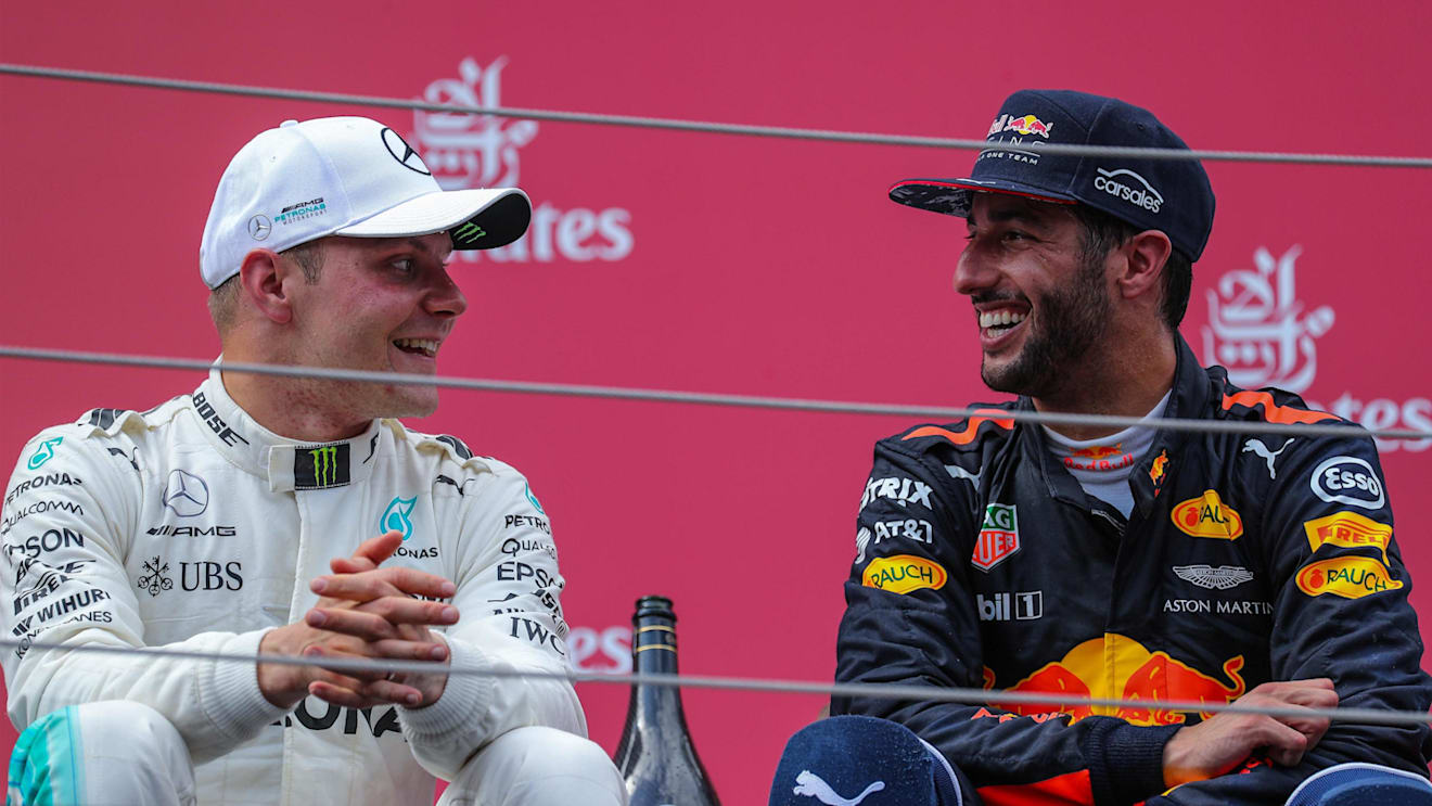 race winner Valtteri Bottas (FIN) Mercedes AMG F1 and Daniel Ricciardo (AUS) Red Bull Racing celebrate on the podium at Formula One World Championship, Rd9, Austrian Grand Prix, Race, Spielberg, Austria, Sunday 9 July 2017. © Sutton Images