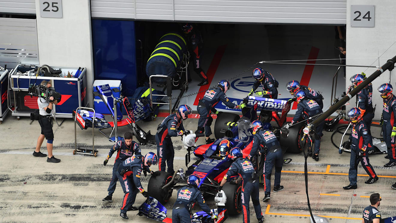 The car of race retiree Carlos Sainz (ESP) Scuderia Toro Rosso STR12 is pushed back into the garage by mechanics at Formula One World Championship, Rd9, Austrian Grand Prix, Race, Spielberg, Austria, Sunday 9 July 2017. © Sutton Images