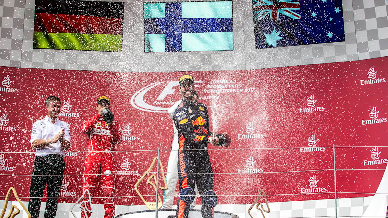 Daniel Ricciardo (AUS) Red Bull Racing celebrates iwht the champagne on the podium at Formula One World Championship, Rd9, Austrian Grand Prix, Race, Spielberg, Austria, Sunday 9 July 2017. © Sutton Images