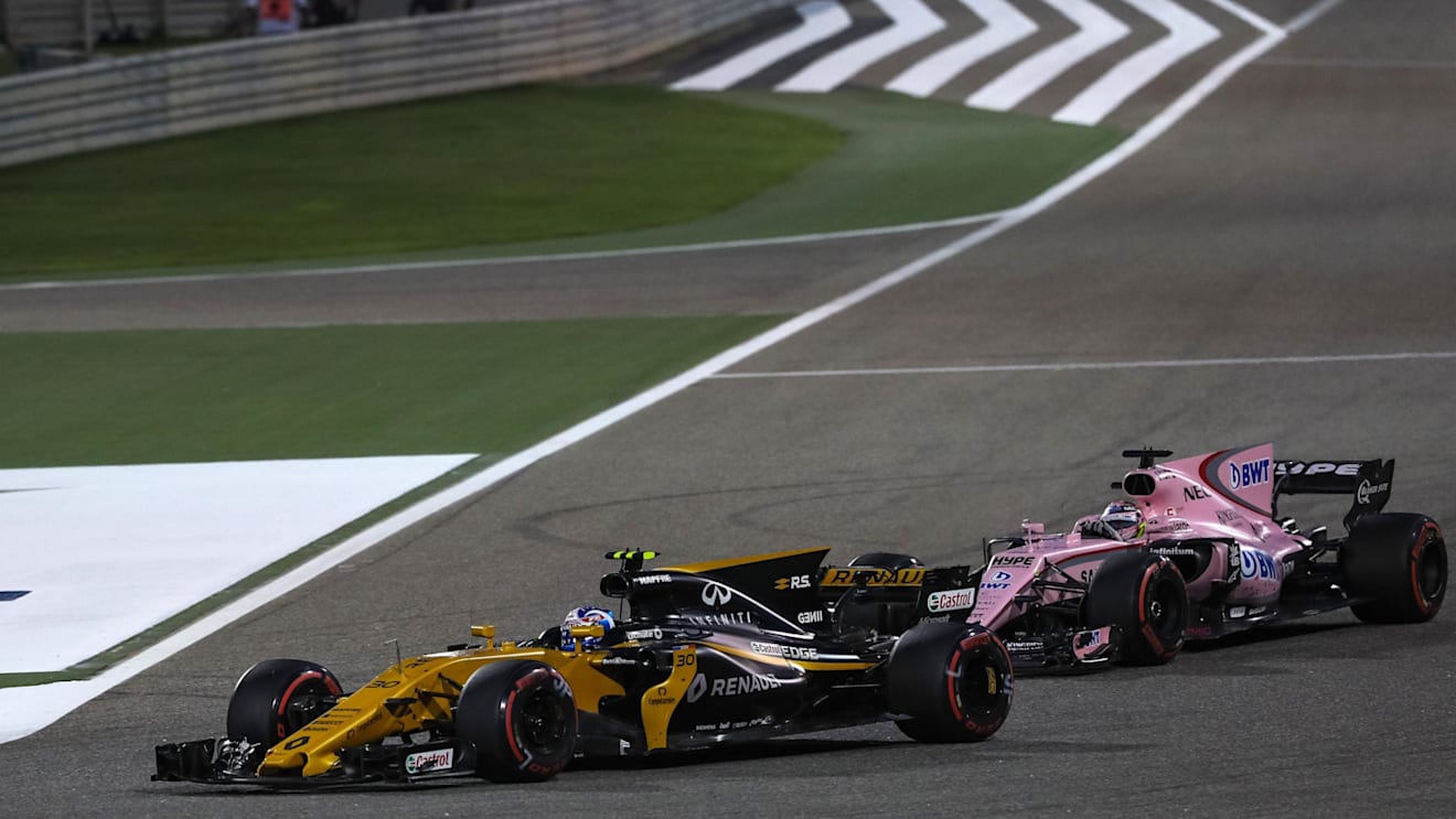 Palmer (GBR) Renault Sport F1 Team RS17 and Perez (MEX) Force India VJM10 battle for position at Formula One World Championship, Rd3, Bahrain Grand Prix Race, Bahrain International Circuit, Sakhir, Bahrain, Sunday 16 April 2017. © Sutton Motorsport Images