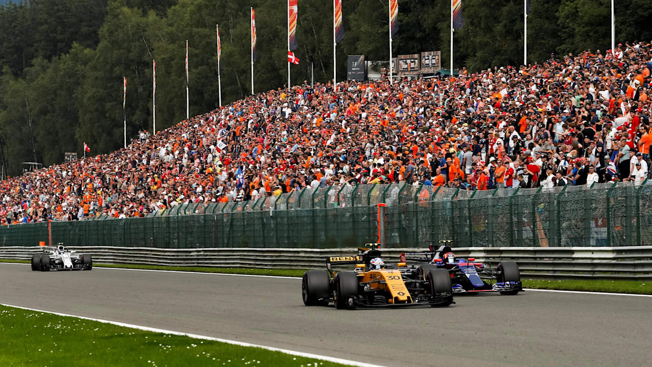 Jolyon Palmer (GBR) Renault Sport F1 Team RS17 and Carlos Sainz jr (ESP) Scuderia Toro Rosso STR12 battle at Formula One World Championship, Rd12, Belgian Grand Prix, Race, Spa Francorchamps, Belgium, Sunday 27 August 2017. © Sutton Images