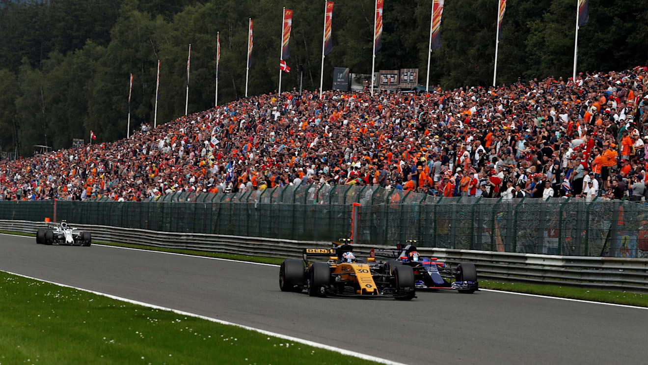 Jolyon Palmer (GBR) Renault Sport F1 Team RS17 and Carlos Sainz jr (ESP) Scuderia Toro Rosso STR12 battle for position at Formula One World Championship, Rd12, Belgian Grand Prix, Race, Spa Francorchamps, Belgium, Sunday 27 August 2017. © Sutton Images