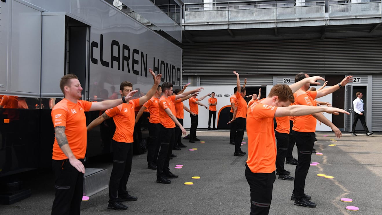 McLaren mechanics warm up excercise at Formula One World Championship, Rd12, Belgian Grand Prix, Race, Spa Francorchamps, Belgium, Sunday 27 August 2017. © Sutton Images