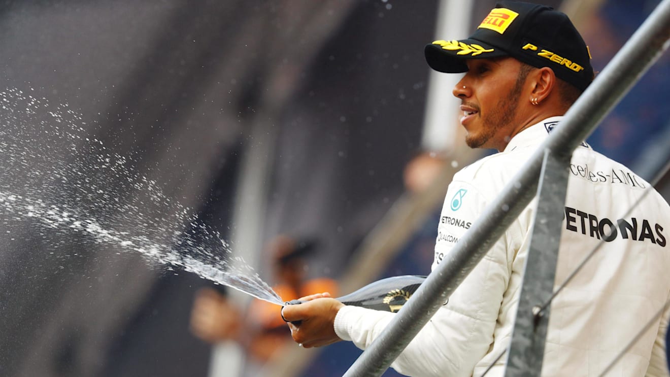 Race winner Lewis Hamilton (GBR) Mercedes AMG F1 celebrates on the podium with the champagne Formula One World Championship, Rd12, Belgian Grand Prix, Race, Spa Francorchamps, Belgium, Sunday 27 August 2017. © Sutton Images