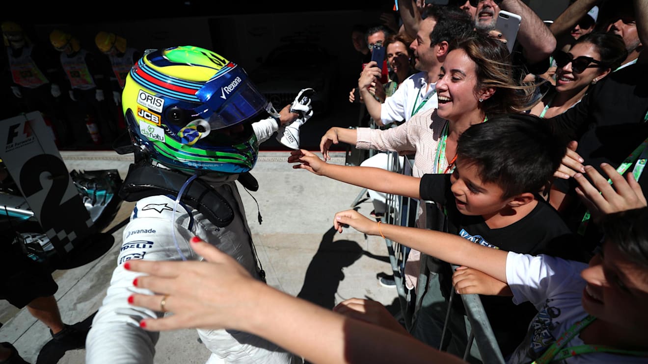 Felipe Massa (BRA) Williams FW40 celebrates his last Brazilian Grand Prix in parc ferme with his wife Rafaela Bassi (BRA) and son Felipinho Massa (BRA) at Formula One World Championship, Rd19, Brazilian Grand Prix, Race, Interlagos, Sao Paulo, Brazil, Sunday 12 November 2017. © Kym Illman/Sutton Images