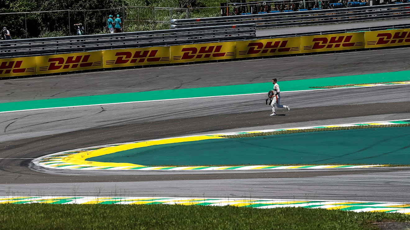 Stoffel Vandoorne (BEL) McLaren runs on track after colliding with Daniel Ricciardo (AUS) Red Bull Racing RB13 and crashing out at the start of the race at Formula One World Championship, Rd19, Brazilian Grand Prix, Race, Interlagos, Sao Paulo, Brazil, Su