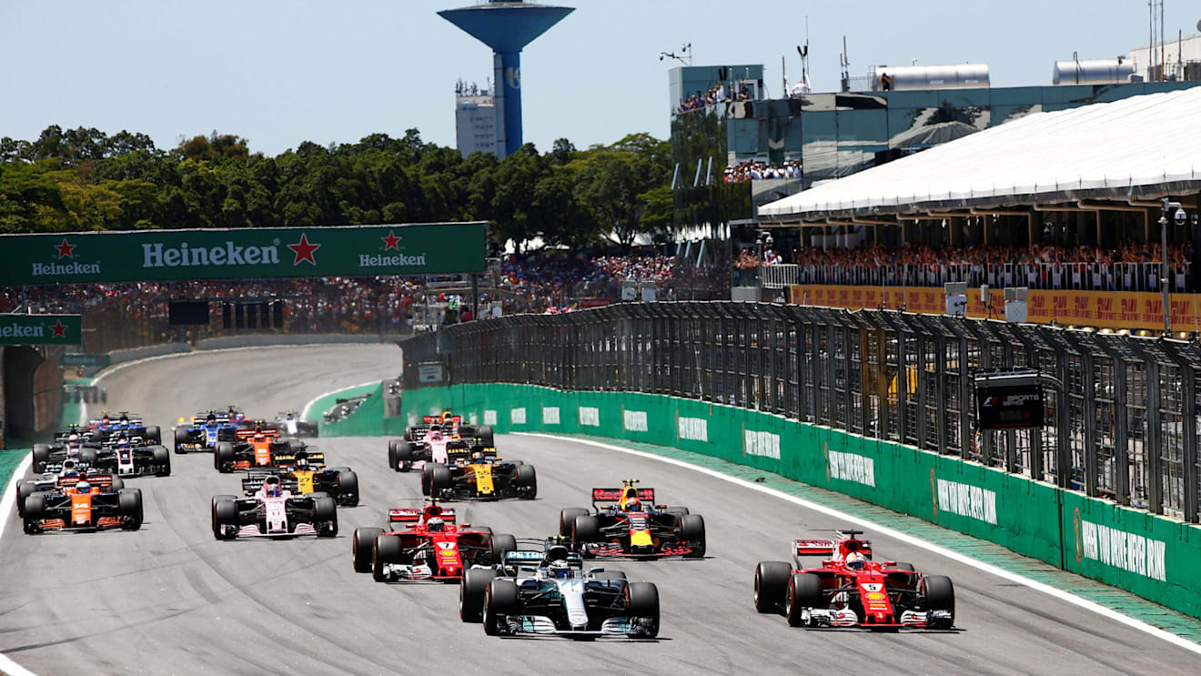 Bottas (FIN) Mercedes-Benz F1 W08 Hybrid and Vettel (GER) Ferrari SF70-H at the start of the race at Formula One World Championship, Rd19, Brazilian Grand Prix, Race, Interlagos, Sao Paulo, Brazil, Sunday 12 November 2017. © Andy Hone/LAT/Sutton Images