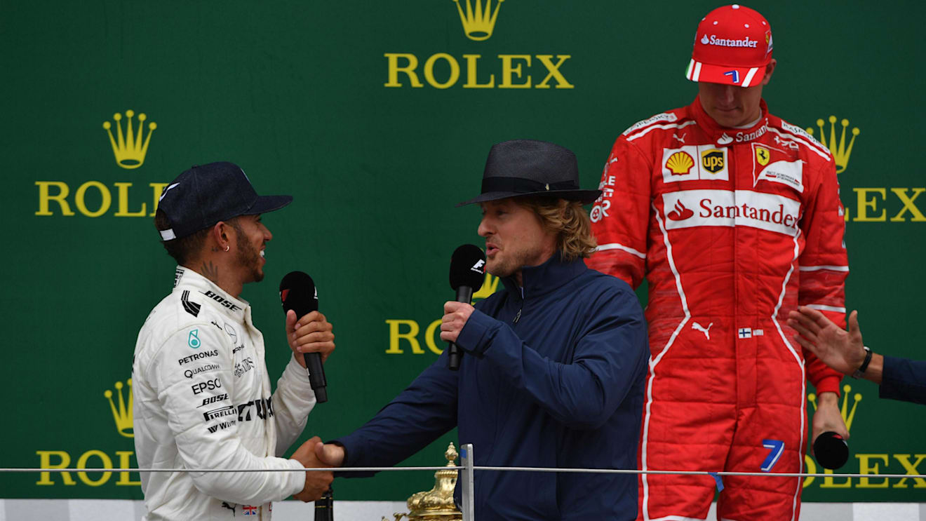 Lewis Hamilton (GBR) Mercedes AMG F1, Owen Wilson (USA) and Kimi Raikkonen (FIN) Ferrari on the podium at Formula One World Championship, Rd10, British Grand Prix, Race, Silverstone, England, Sunday 16 July 2017. © Sutton Images