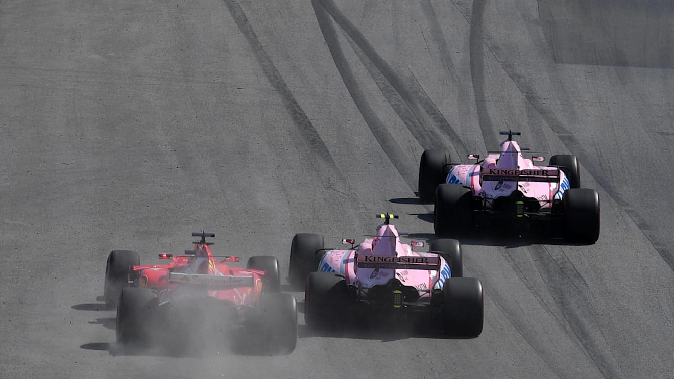 Sergio Perez (MEX) Force India VJM10, Esteban Ocon (FRA) Force India VJM10 and Sebastian Vettel (GER) Ferrari SF70-H battle at Formula One World Championship, Rd7, Canadian Grand Prix, Race, Montreal, Canada, Sunday 11 June 2017. © Sutton Motorsport Images