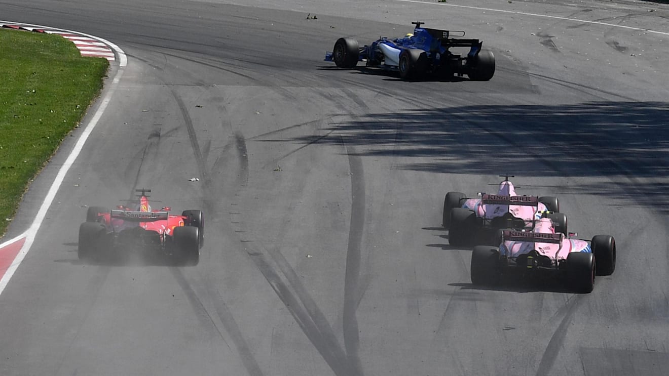 Sergio Perez (MEX) Force India VJM10, Esteban Ocon (FRA) Force India VJM10 and Sebastian Vettel (GER) Ferrari SF70-H battle at Formula One World Championship, Rd7, Canadian Grand Prix, Race, Montreal, Canada, Sunday 11 June 2017. © Sutton Motorsport Images