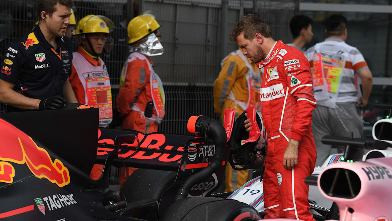Sebastian Vettel (GER) Ferrari looks at the Red Bull Racing RB13 in parc ferme at Formula One World Championship, Rd2, Chinese Grand Prix, Qualifying, Shanghai, China, Saturday 8 April 2017. © Sutton Motorsport Images
