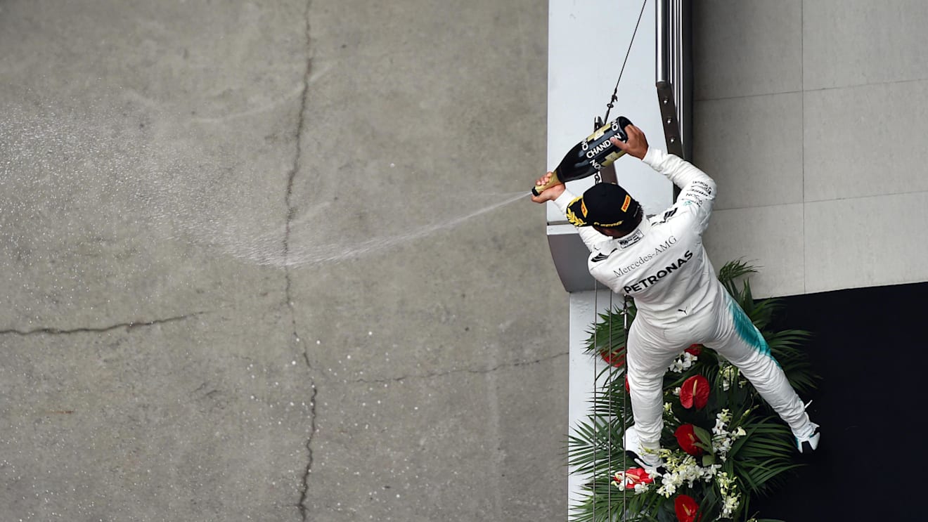 Race winner Lewis Hamilton (GBR) Mercedes AMG F1 celebrates on the podium with the champagne at Formula One World Championship, Rd2, Chinese Grand Prix, Race, Shanghai, China, Sunday 9 April 2017. © Sutton Motorsport Images