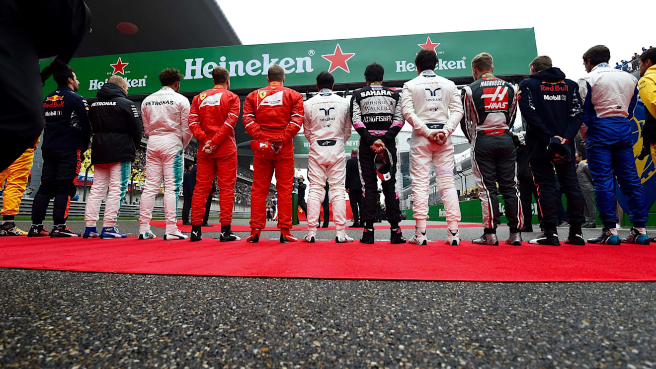 Drivers observe the National Anthem on the grid at Formula One World Championship, Rd2, Chinese Grand Prix, Race, Shanghai, China, Sunday 9 April 2017. © Sutton Motorsport Images