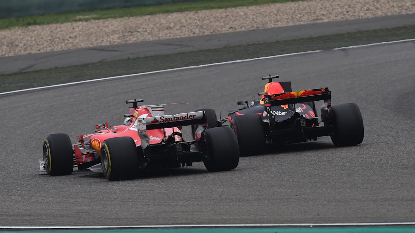 Sebastian Vettel (GER) Ferrari SF70-H and Daniel Ricciardo (AUS) Red Bull Racing RB13 battle at Formula One World Championship, Rd2, Chinese Grand Prix, Race, Shanghai, China, Sunday 9 April 2017. © Sutton Motorsport Images