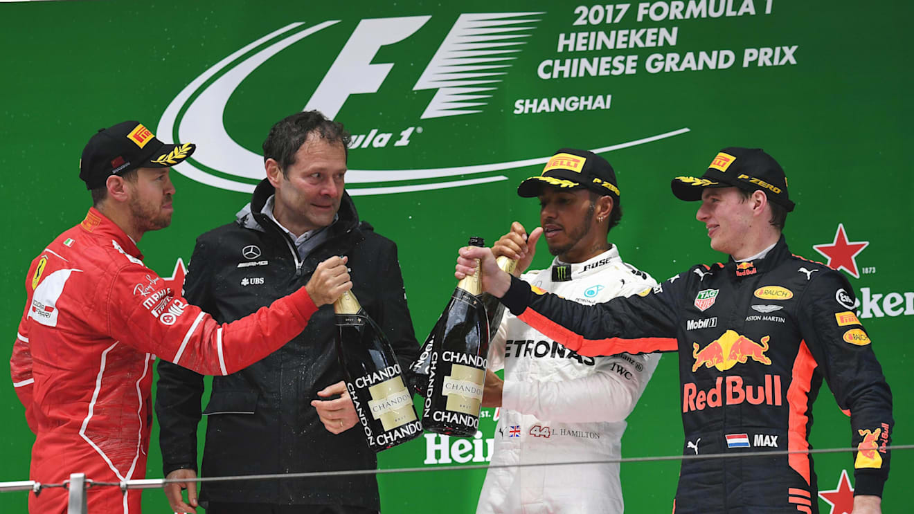 Sebastian Vettel (GER) Ferrari, Aldo Costa (ITA) Mercedes AMG, Lewis Hamilton (GBR) Mercedes AMG and Max Verstappen (NED) Red Bull celebrate on the podium at F1 World Championship, Chinese Grand Prix, Shanghai, 9 April 2017. ©Sutton Motorsport Images