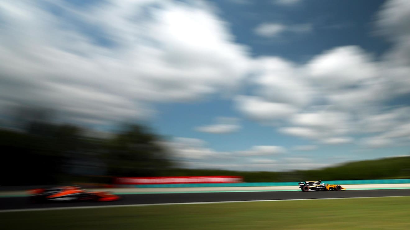 Jolyon Palmer (GBR) Renault Sport F1 Team RS17 with puncture and damage in FP1 and Stoffel Vandoorne (BEL) McLaren MCL32 at Formula One World Championship, Rd11, Hungarian Grand Prix, Practice, Hungaroring, Hungary, Friday 28 July 2017. © Sutton Images