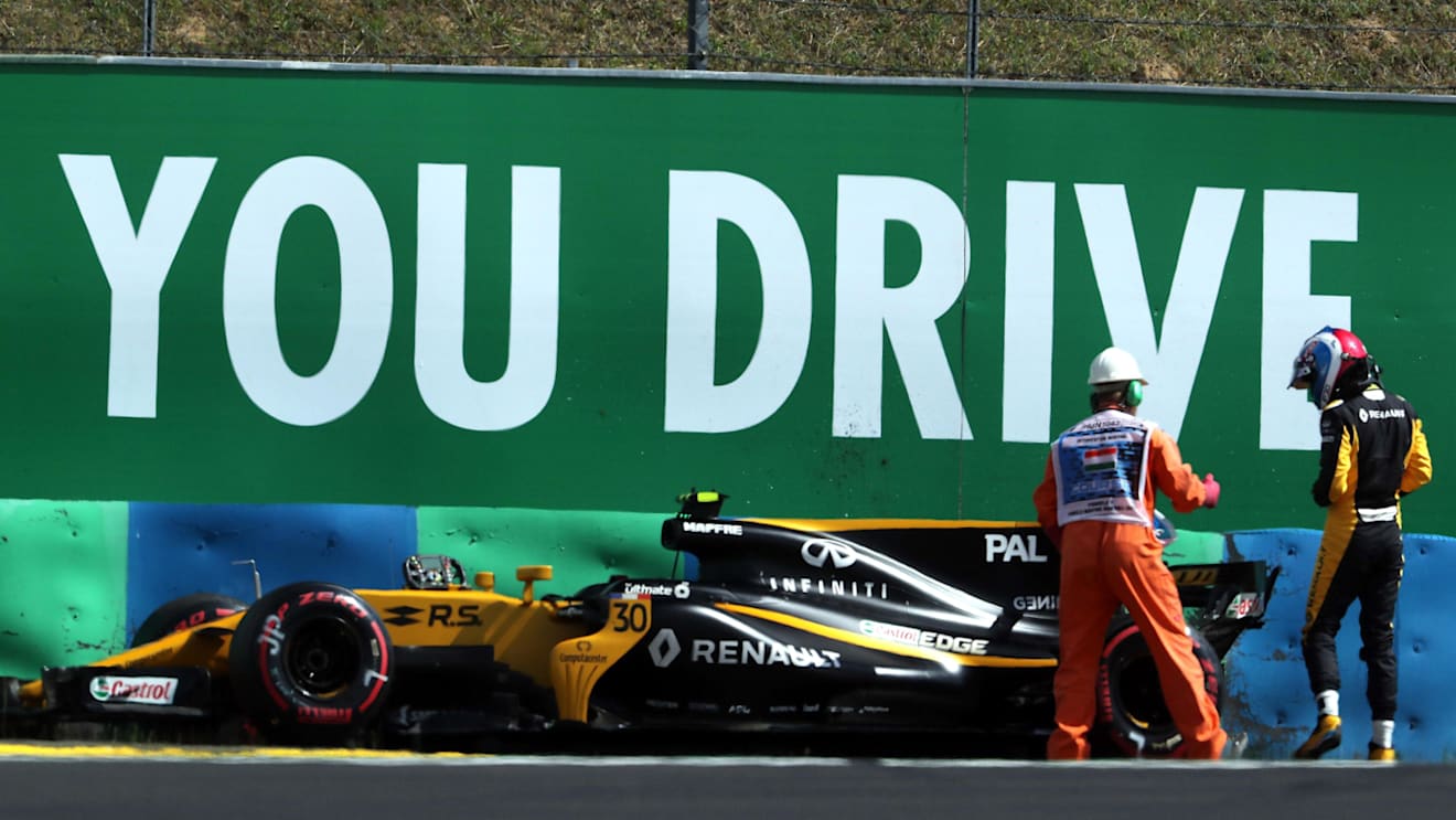 Marshal and the crashed car of Jolyon Palmer (GBR) Renault Sport F1 Team RS17 in FP2 at Formula One World Championship, Rd11, Hungarian Grand Prix, Practice, Hungaroring, Hungary, Friday 28 July 2017. © Sutton Images