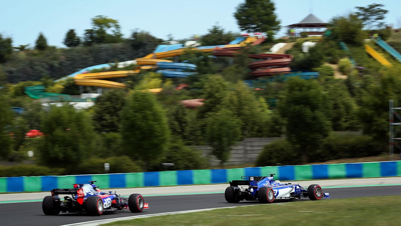 Daniil Kvyat (RUS) Scuderia Toro Rosso STR12 and Marcus Ericsson (SWE) Sauber C36 at Formula One World Championship, Rd11, Hungarian Grand Prix, Practice, Hungaroring, Hungary, Friday 28 July 2017. © Sutton Images