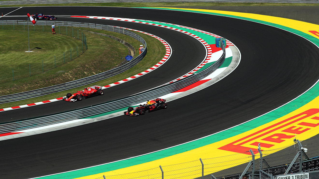 Daniel Ricciardo (AUS) Red Bull Racing RB13 and Kimi Raikkonen (FIN) Ferrari SF70-H at Formula One World Championship, Rd11, Hungarian Grand Prix, Qualifying, Hungaroring, Hungary, Saturday 29 July 2017. © Sutton Images
