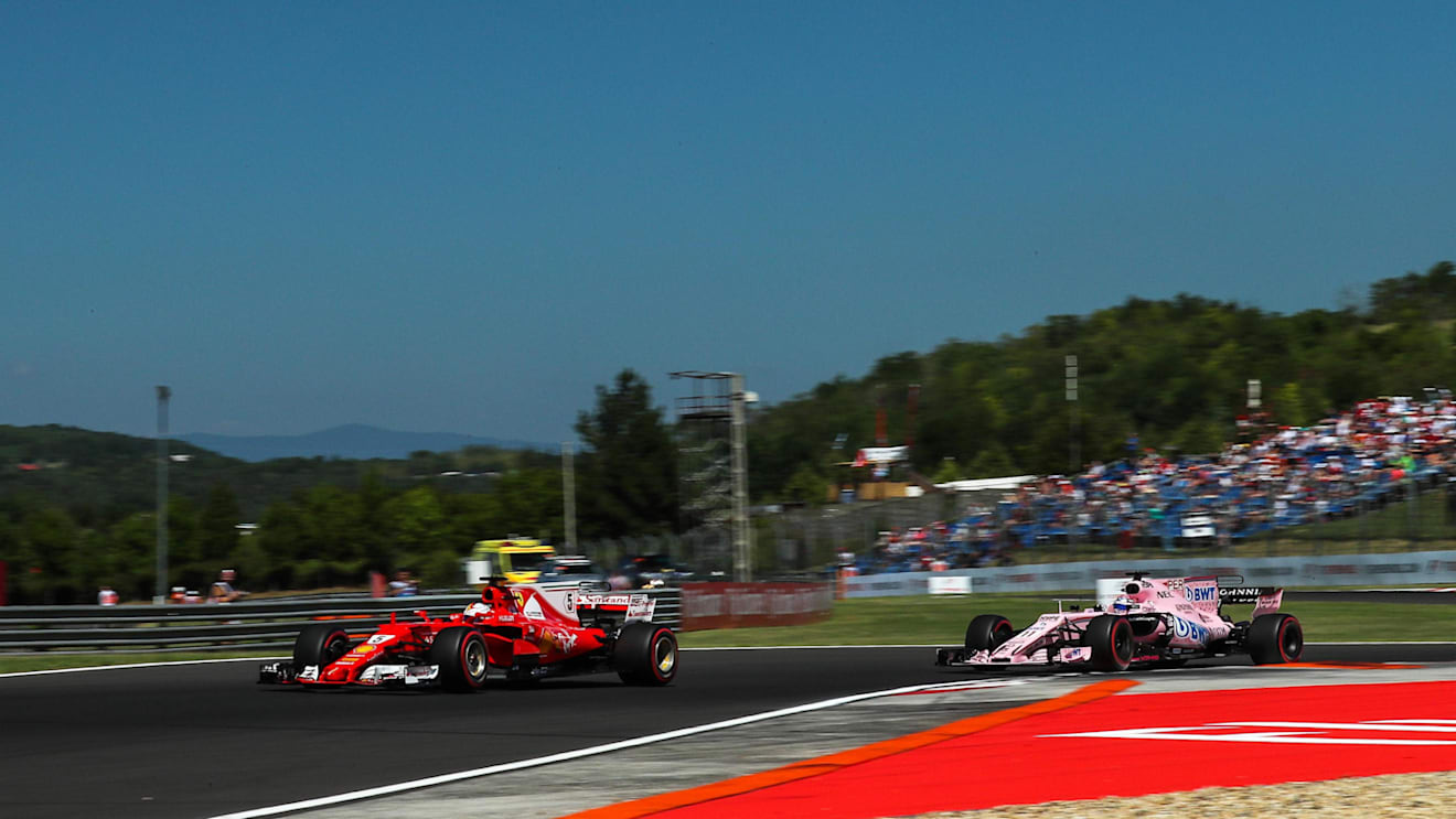 Sebastian Vettel (GER) Ferrari SF70-H and Sergio Perez (MEX) Force India VJM10 at Formula One World Championship, Rd11, Hungarian Grand Prix, Qualifying, Hungaroring, Hungary, Saturday 29 July 2017. © Sutton Images