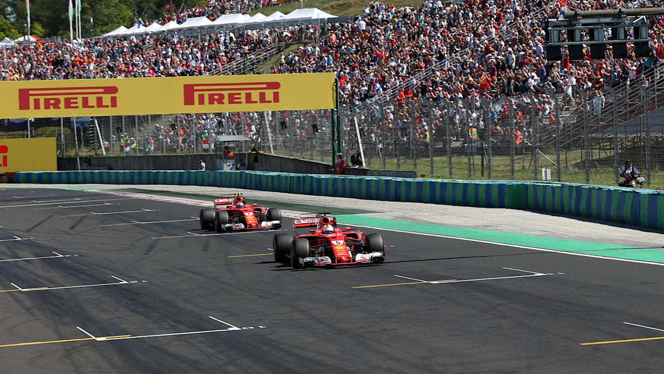 Pole sitter Sebastian Vettel (GER) Ferrari SF70-H and Kimi Raikkonen (FIN) Ferrari SF70-H arrive in parc ferme at Formula One World Championship, Rd11, Hungarian Grand Prix, Qualifying, Hungaroring, Hungary, Saturday 29 July 2017. © Sutton Images