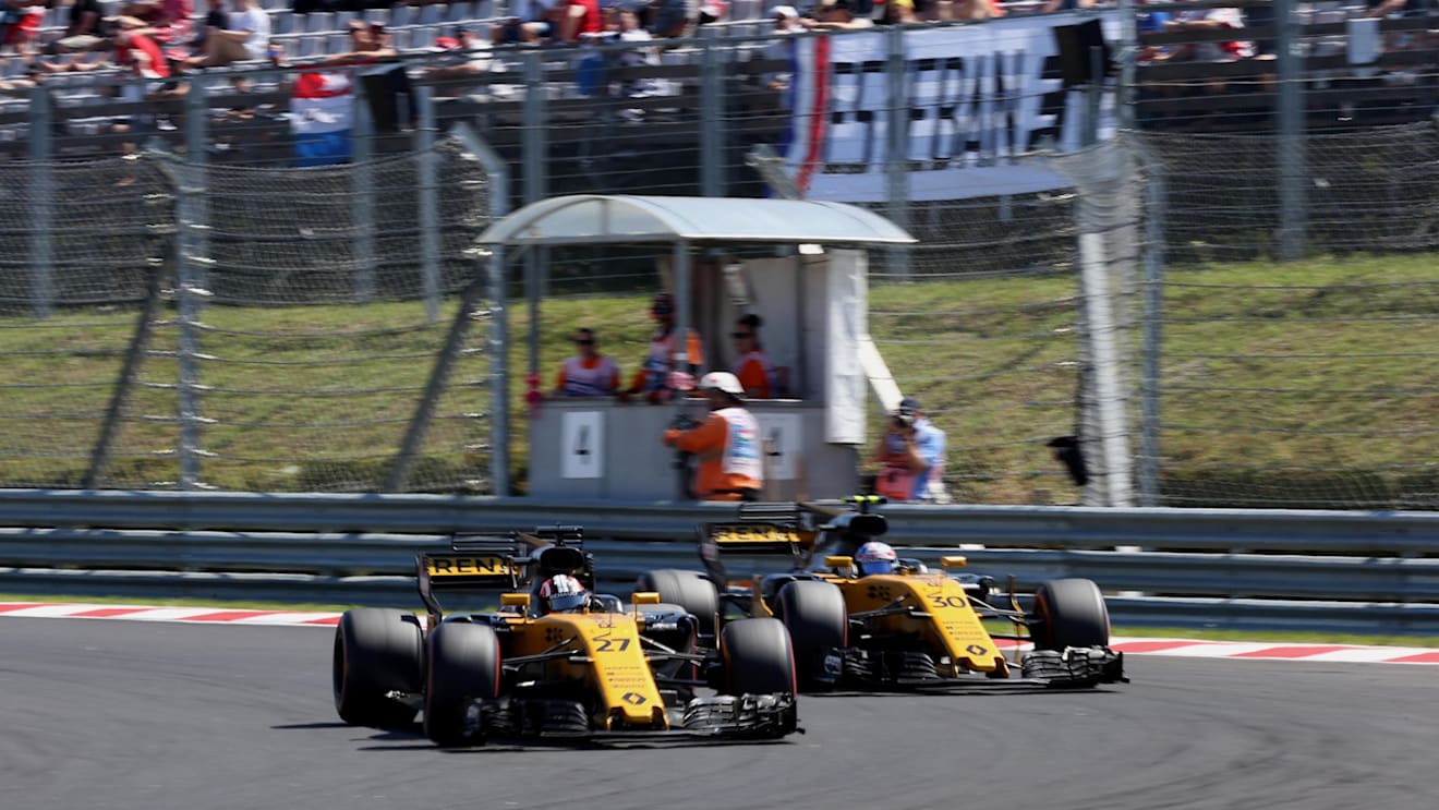 Nico Hulkenberg (GER) Renault Sport F1 Team RS17 passes Jolyon Palmer (GBR) Renault Sport F1 Team RS17 at Formula One World Championship, Rd11, Hungarian Grand Prix, Race, Hungaroring, Hungary, Sunday 30 July 2017. © Sutton Images