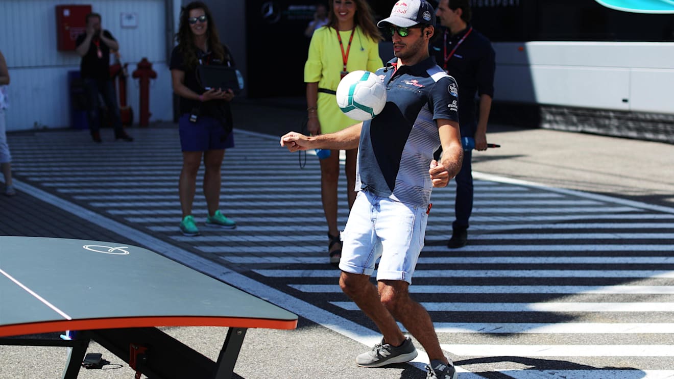 Carlos Sainz (ESP) Scuderia Toro Rosso and football at Formula One World Championship, Rd11, Hungarian Grand Prix, Race, Hungaroring, Hungary, Sunday 30 July 2017. © Sutton Images